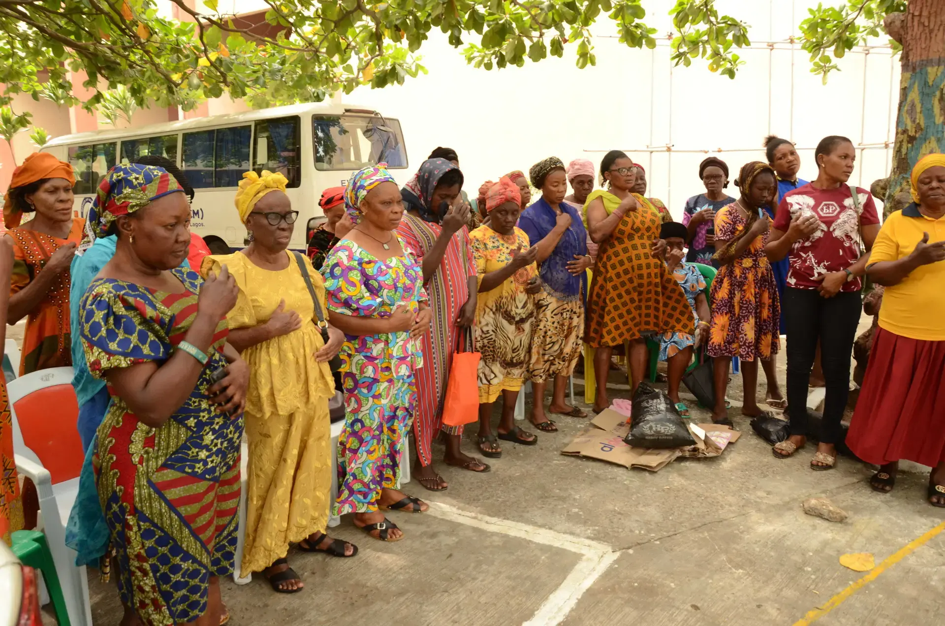 Women gathered in a circle at an outreach